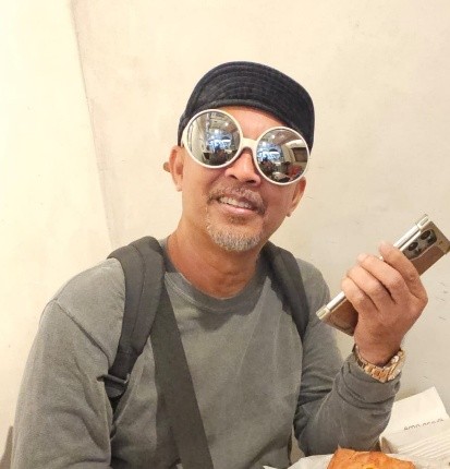Photo of Ayob Ismail in sunglasses